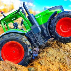 TRACTOR GETS STUCK! Toy TRACTOR Rescue RC CARS!
