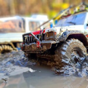 Off-Road Drama: RC JEEP Cherokee and RC TRUCK Unimog Tackle Mud with Epic Winch Save!