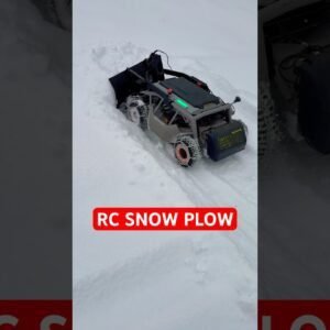 Heavy Duty RC Mower Converted Into RC Snow Plow In Action! Four Wheel Drive With Snow Chains!