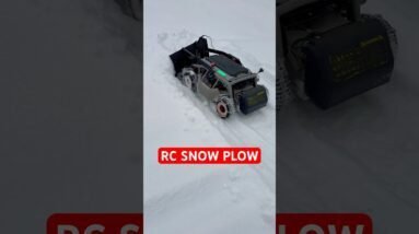 Heavy Duty RC Mower Converted Into RC Snow Plow In Action! Four Wheel Drive With Snow Chains!